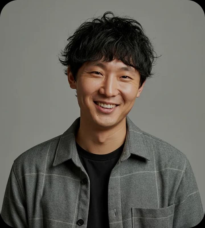 Young man smiling in dark jacket